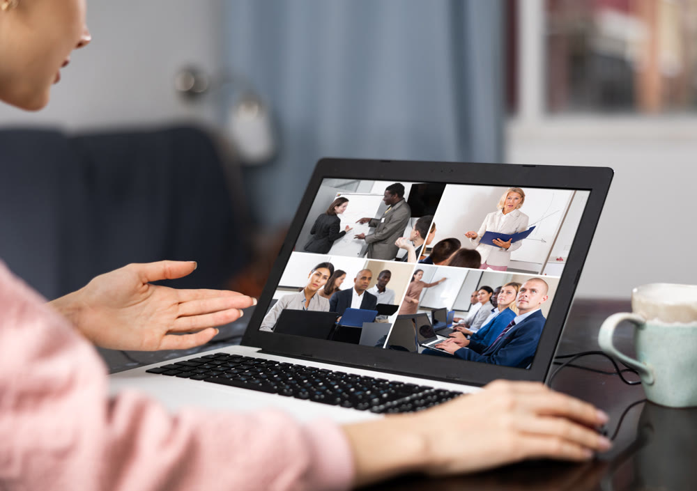 Woman having video conference with colleagues