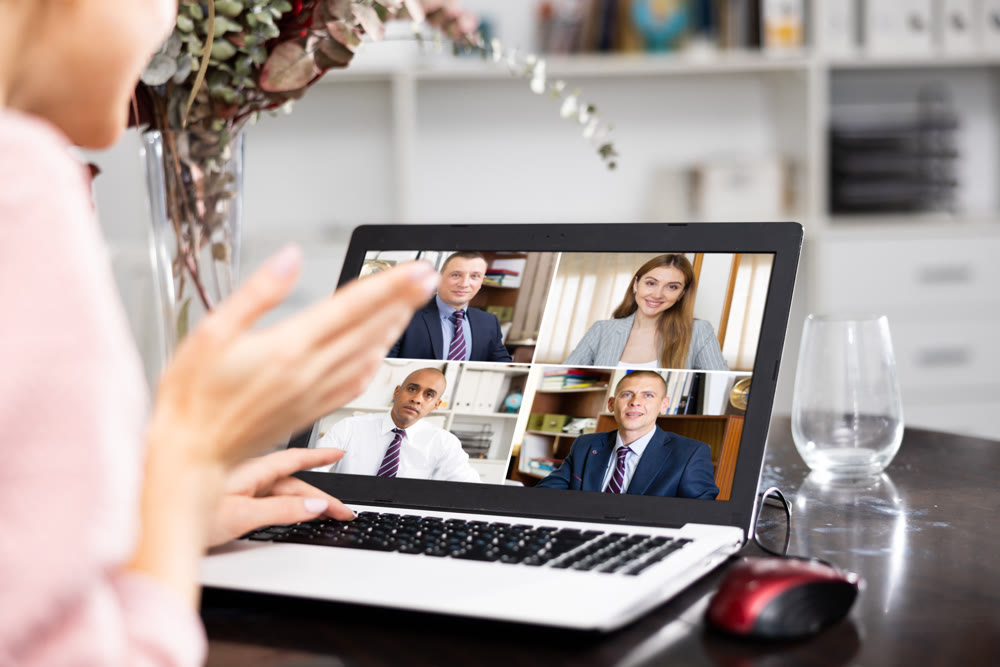 Young woman is holding a video conference on a laptop