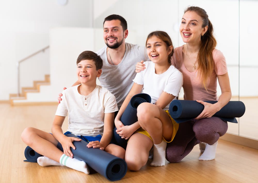 Group photo of family in fitness studio