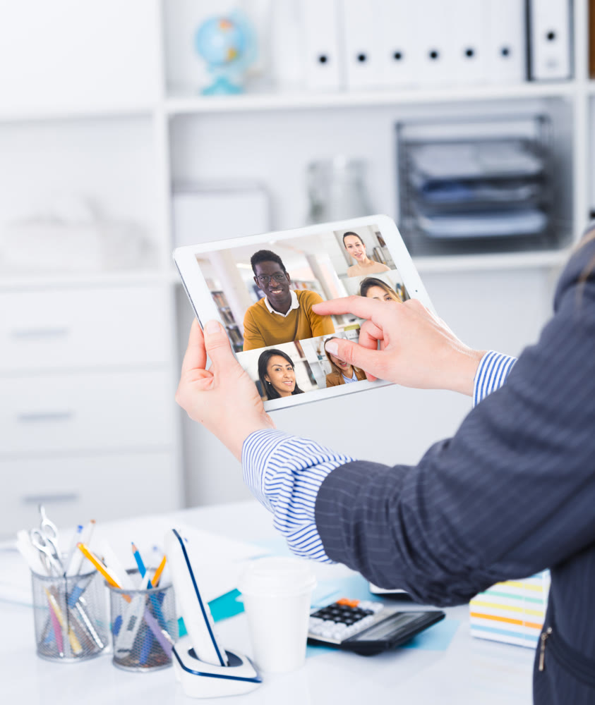 Video conference on smartphone or tablet, business meeting. Communication with business colleagues via video conference closeup