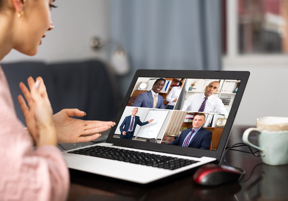 Manager holding online meeting on laptop