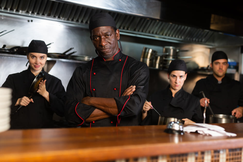 Team of chefs with man head chef