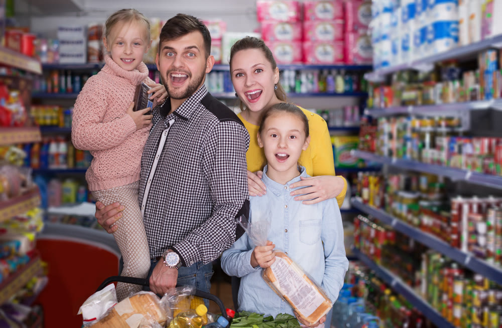 parents with girls with purchases during family shopping