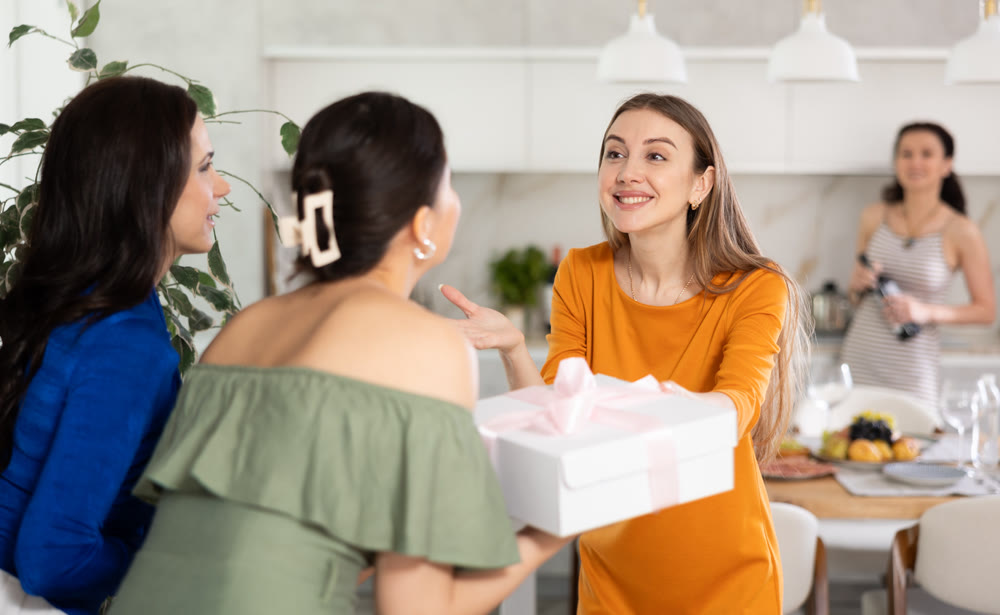 Happy women greeting each other before starting house party