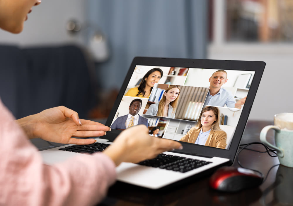Young woman is holding a video conference on a laptop