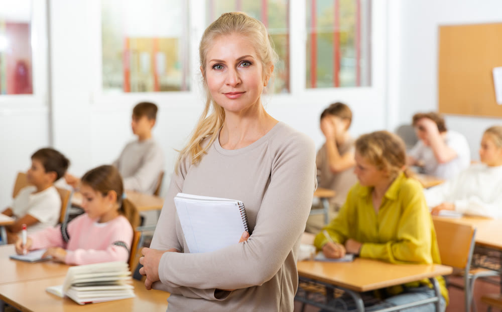 Portrait of positive female school teacher