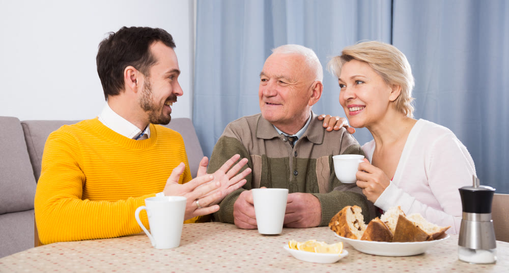 Smiling family having breakfast