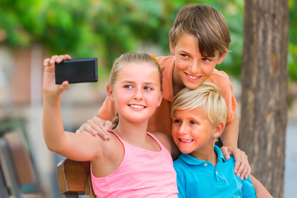 Children are taking selfie