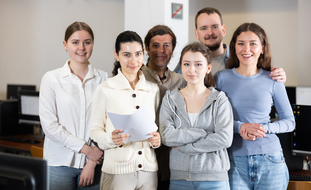 Portrait of group of students in university computer lab