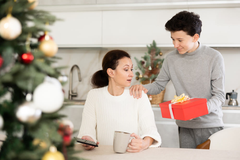 Son giving gift to mother