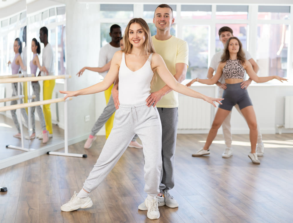 Couple young woman and man dancing waltz