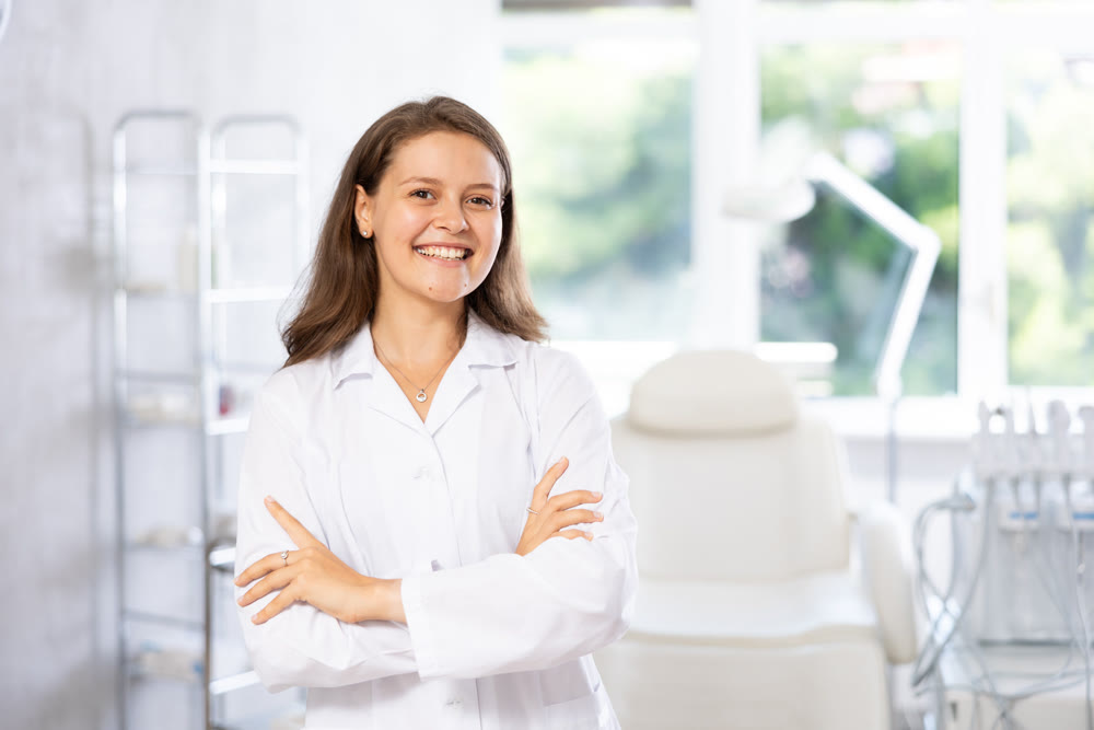 Cosmetic doctor stands confidently