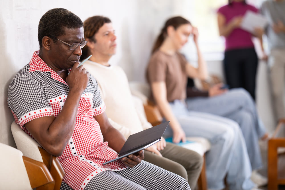 Group of of different ages in the office while waiting for an interview. Specialists, men and women in search of job are waiting for an interview in prestigious company
