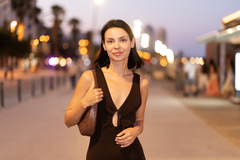 Young woman walking on promenade of Barceloneta
