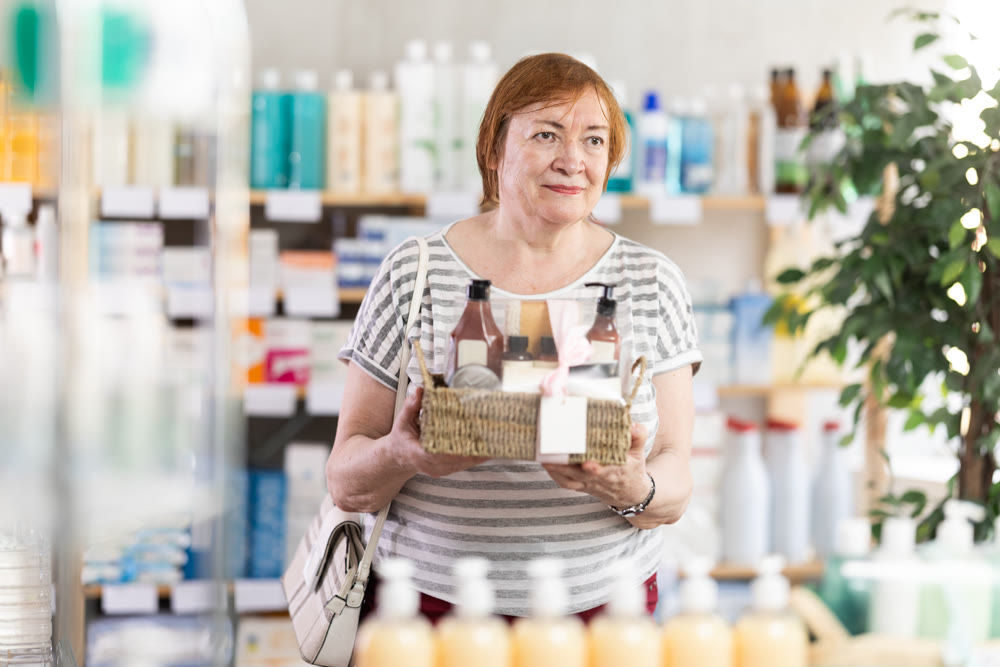 Senior woman are busy choosing bath cosmetic set at pharmacy