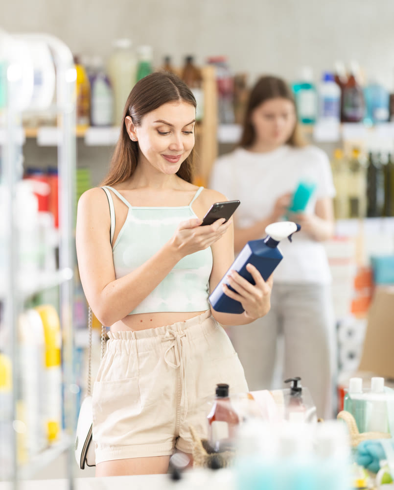 woman scanning spray barcode on her phone