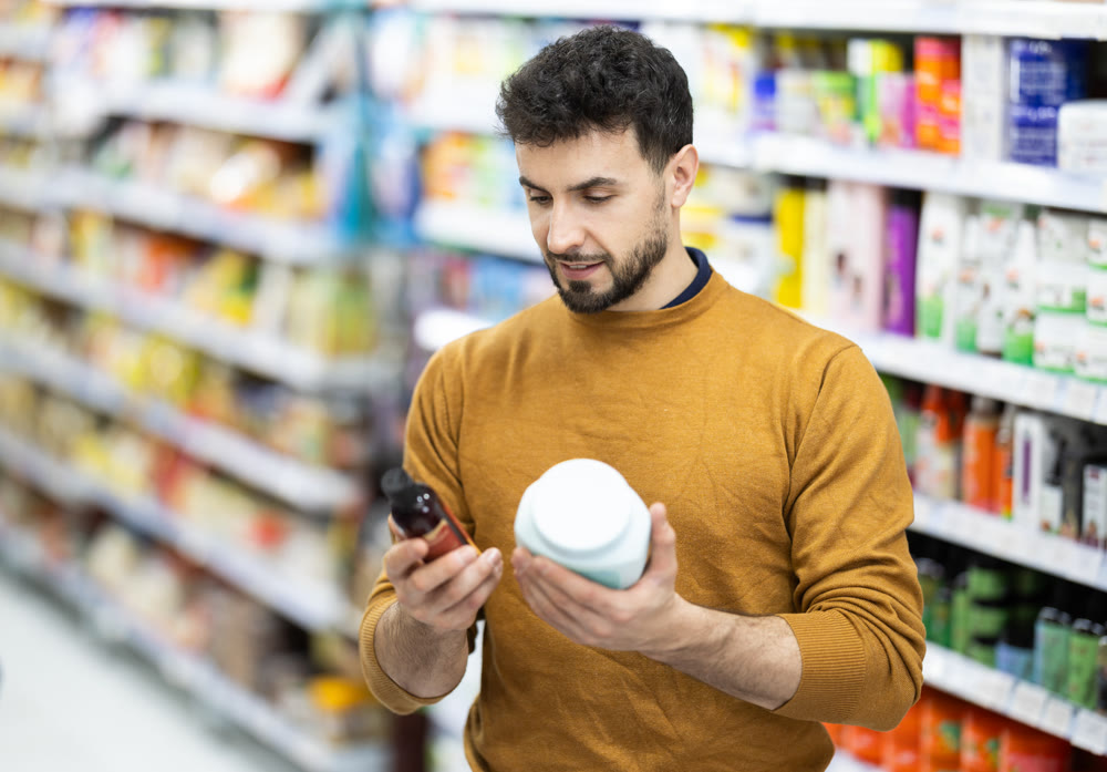 Man spends time in store, looking for goods and select care product