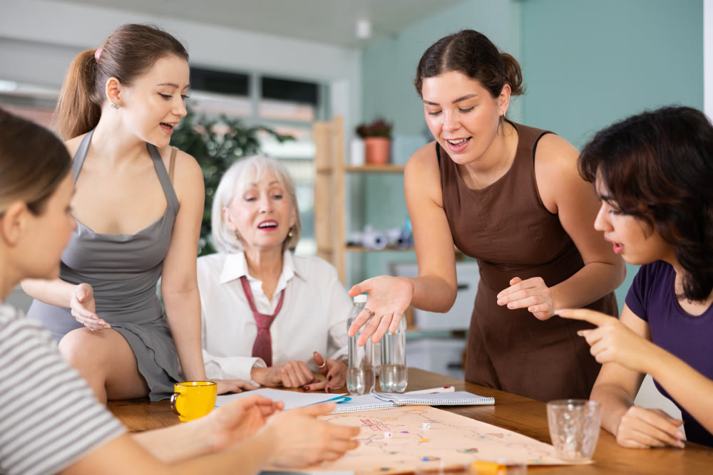 Female colleagues playing board game