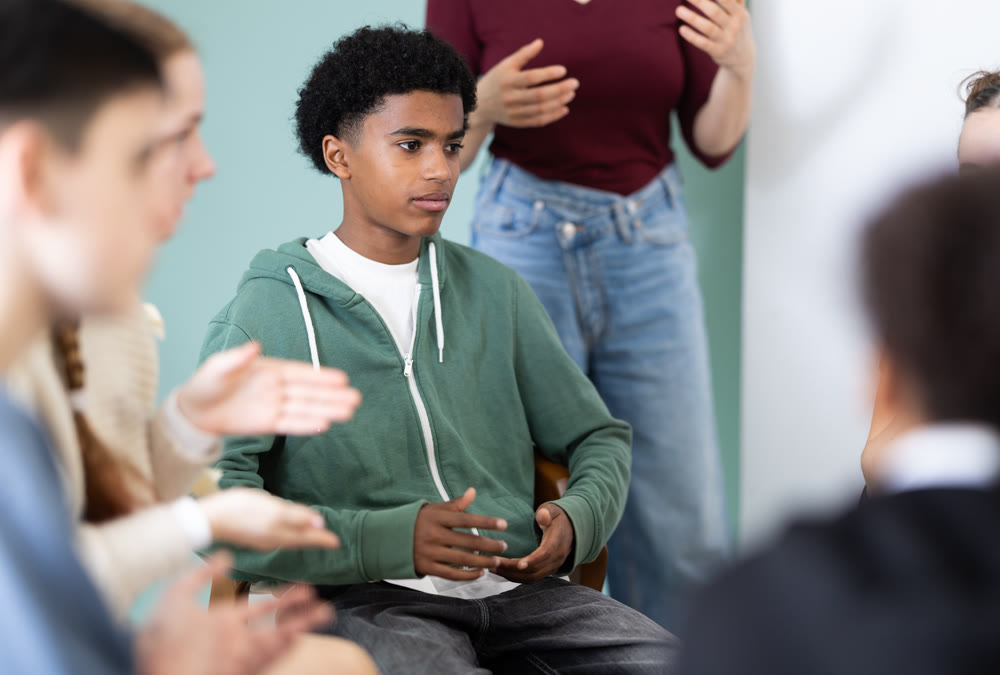 Teenage boy participating in group communication