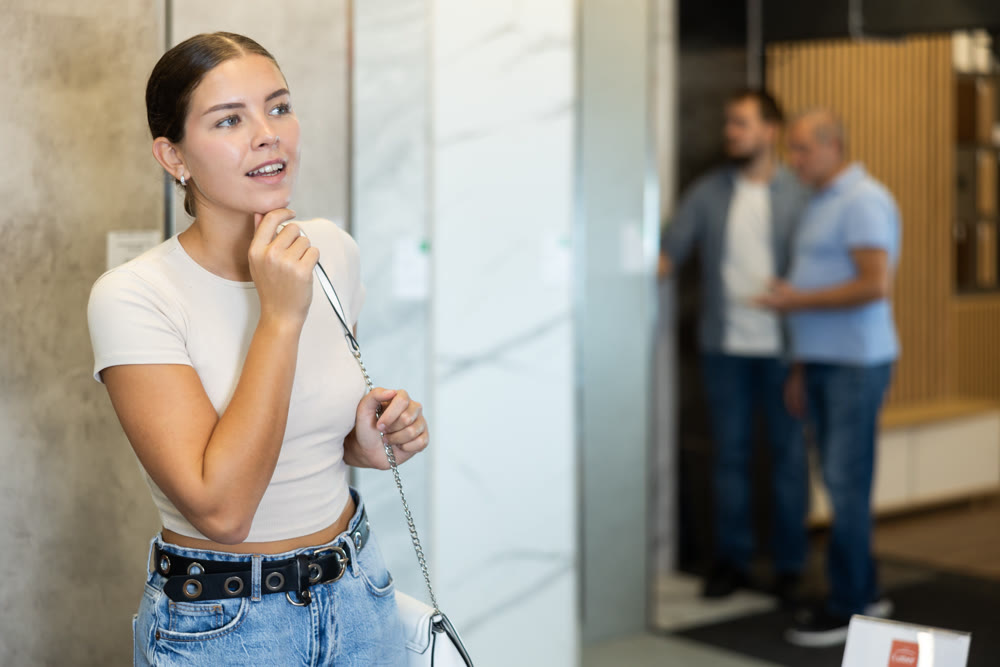 Young woman looking around in building store