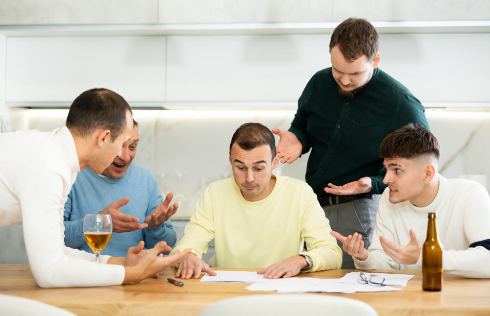 Group of men supporting troubled friend reading legal notice