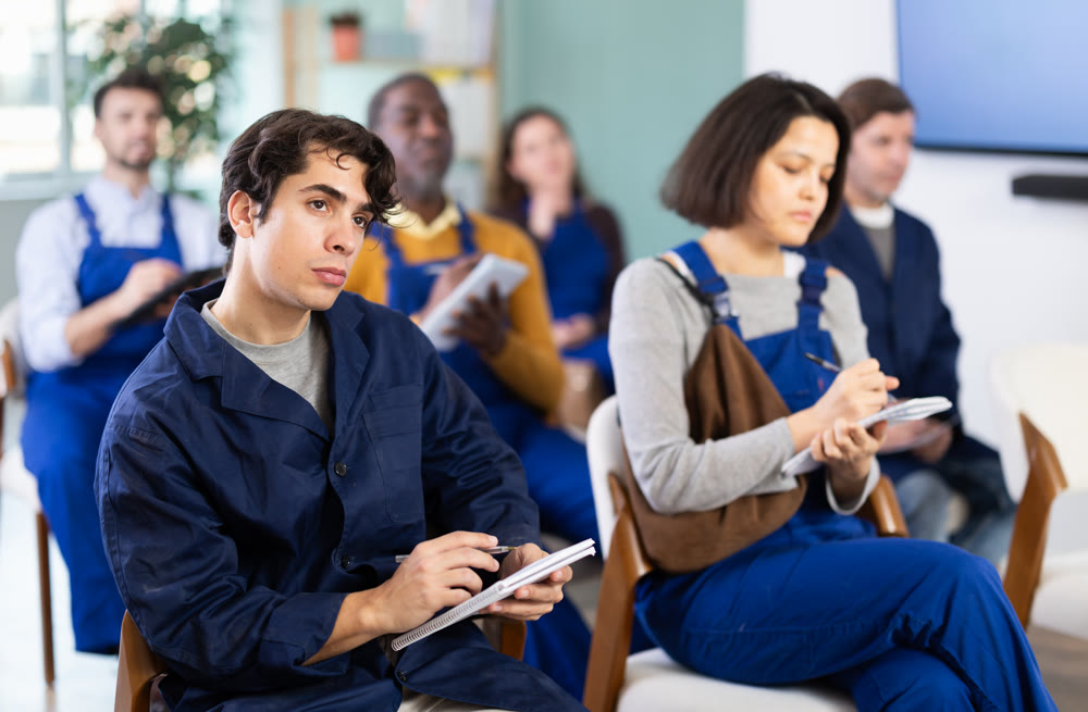 Portrait of an attentive young worker on refresher course