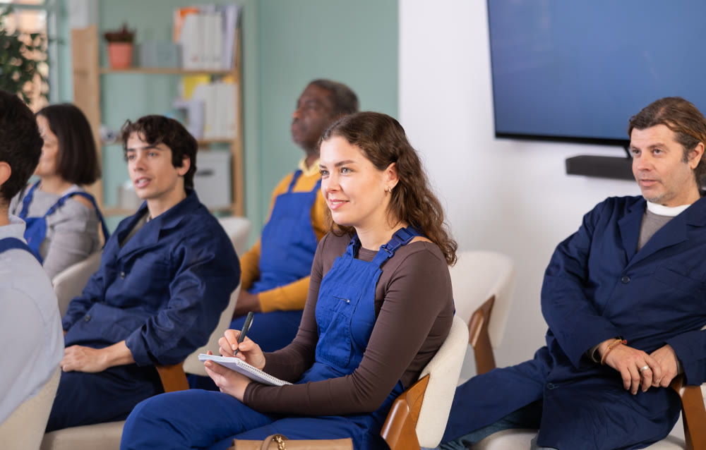 Portrait of an attentive young female worker on refresher course