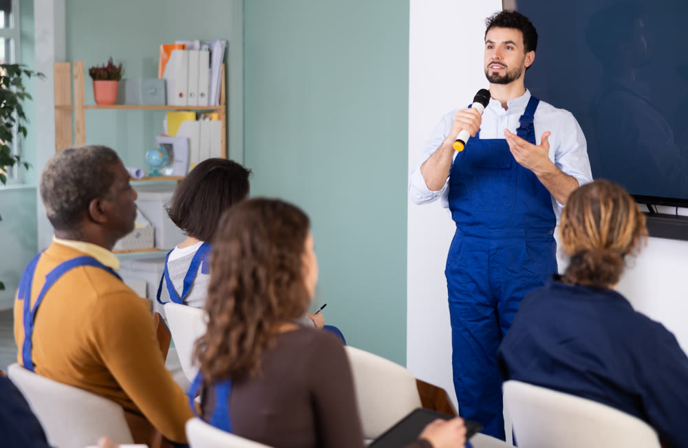 Male mentor teaches students new skills in vocational fields