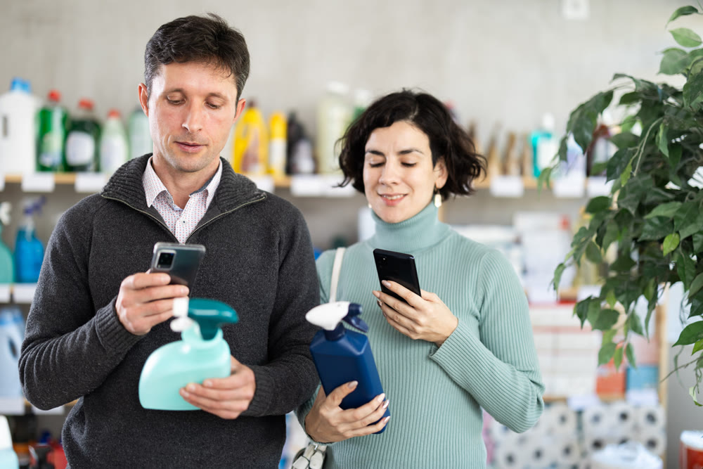 Couple man and woman scanning qr code for cleaning spray