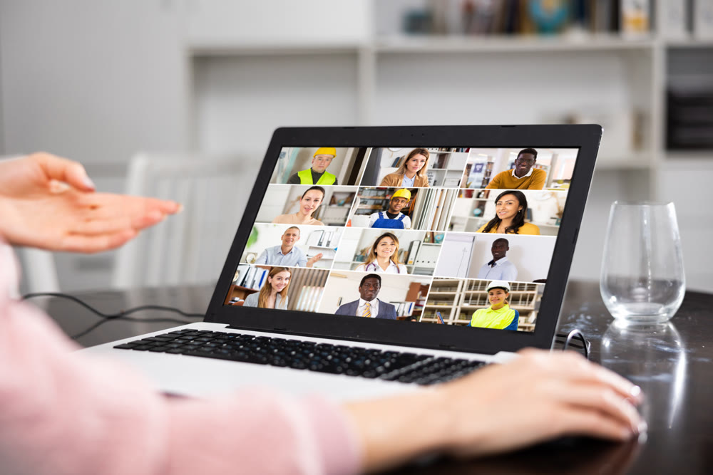 Young woman is holding a video conference on a laptop