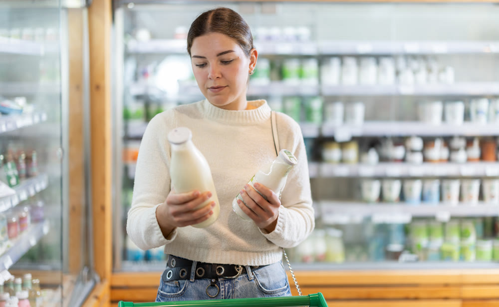 woman chooses dairy products