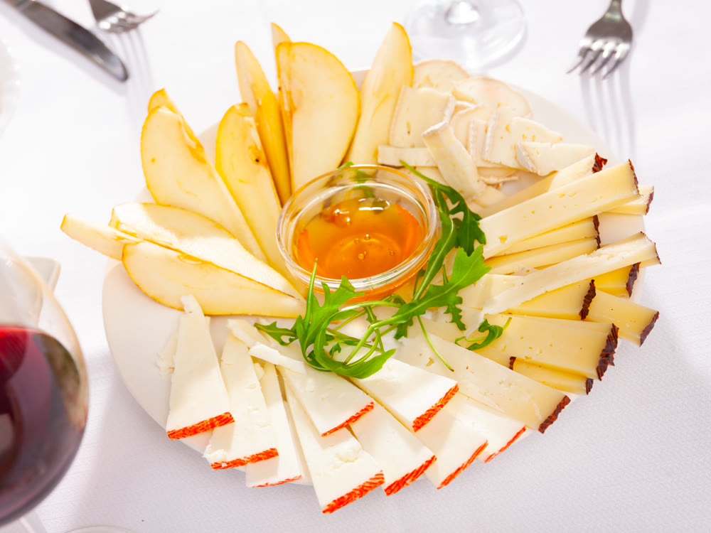 Cheese plate with pears and honey
