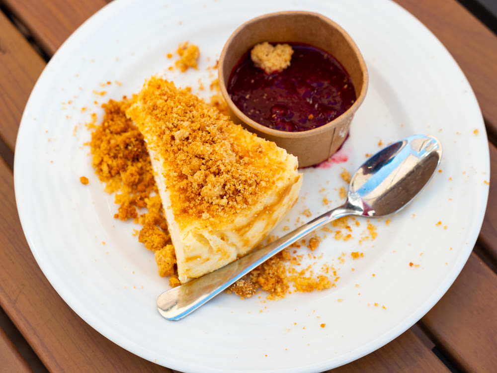 Raspberry cheesecake on saucer with berry topping