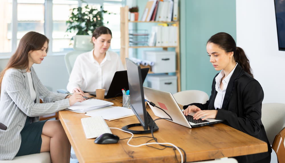 group of employees working in an office