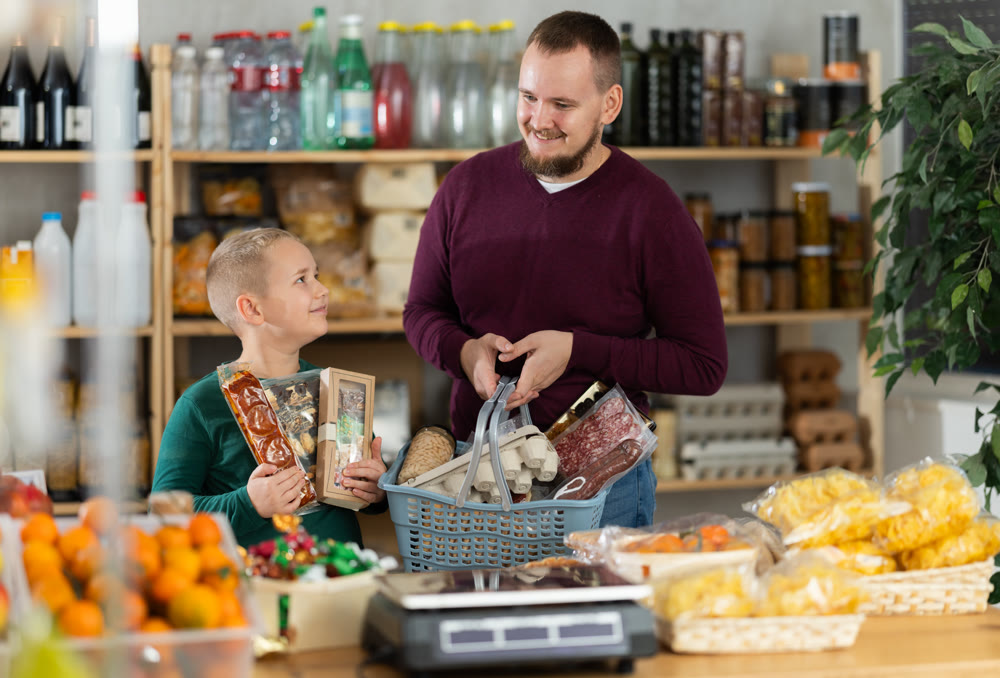 Father and son shopping together in grocery store