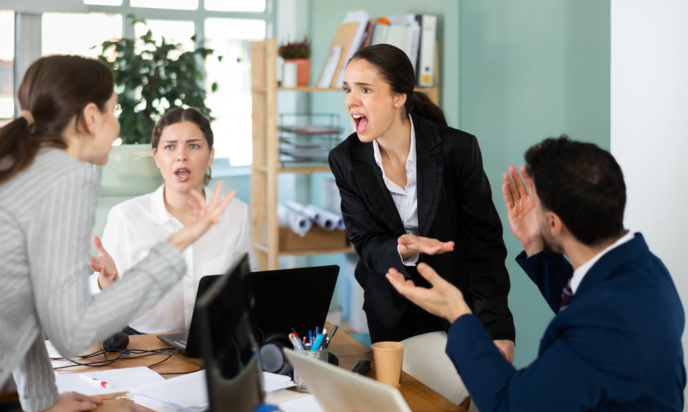 Angry group of colleagues arguing during office meeting