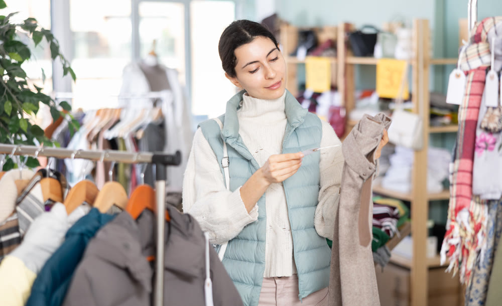 Regular customer Armenian woman chooses color and style of trousers