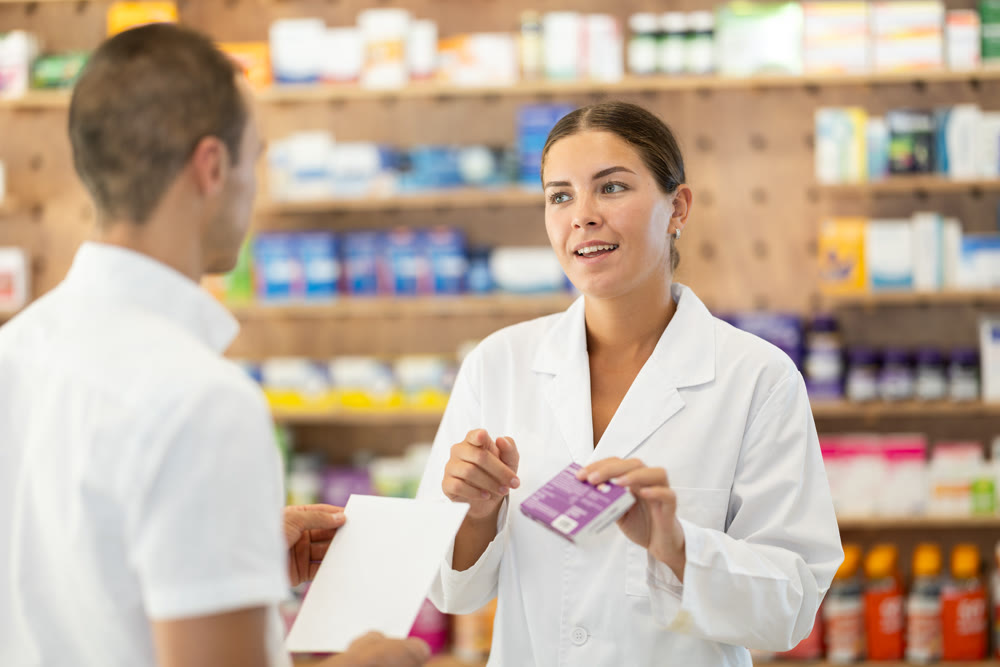 Man client with prescription should contact girl pharmacist for help, takes box remedy