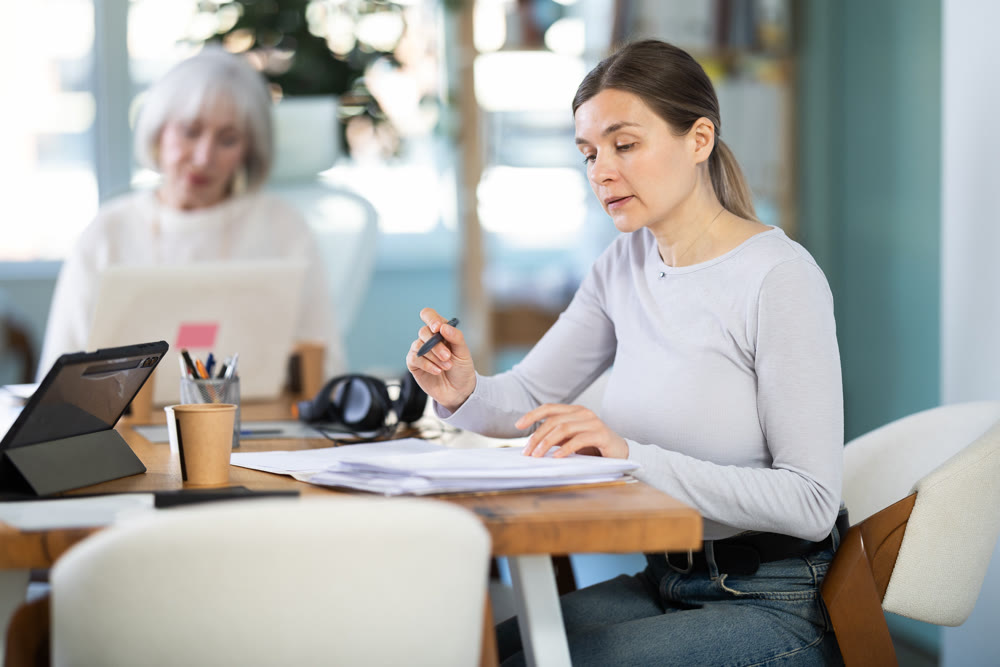 Woman working, fill in document in office