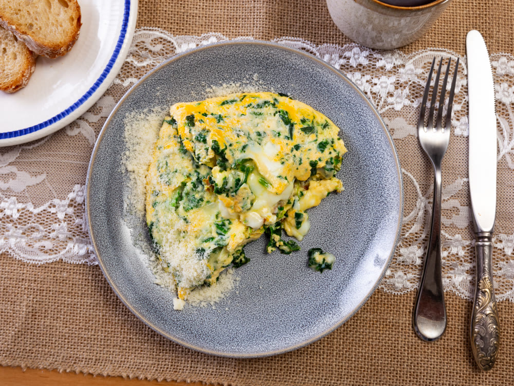 Omelette with spinach served on platter