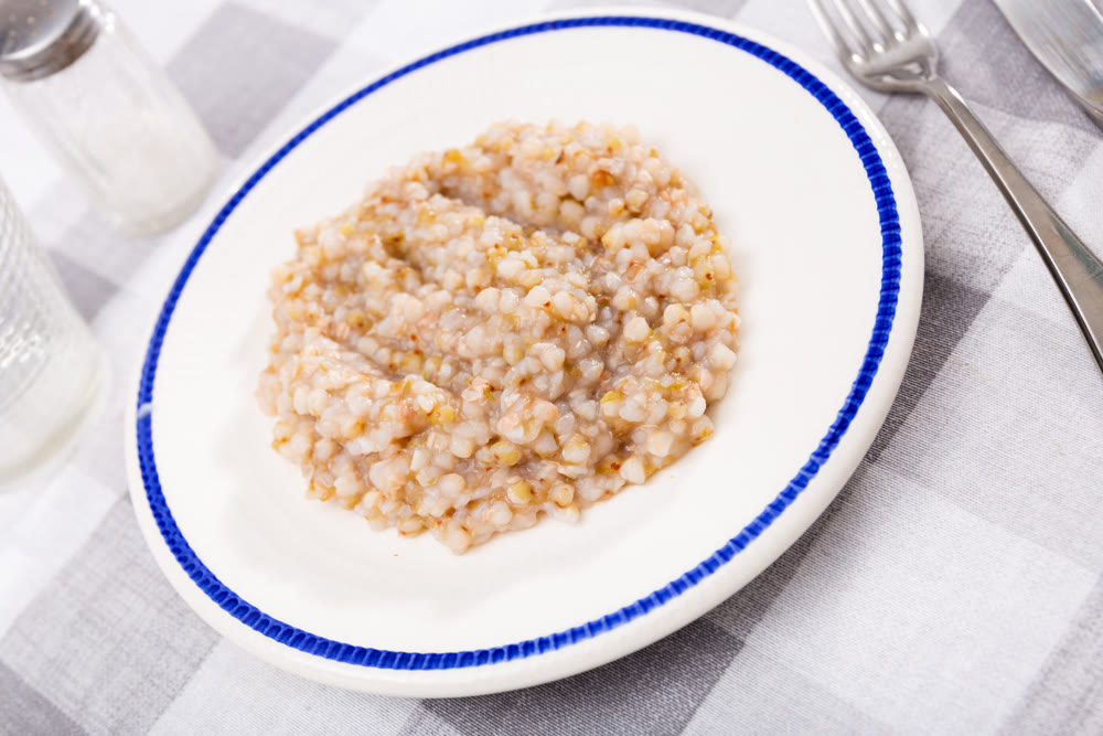 Buckwheat porridge served on plate