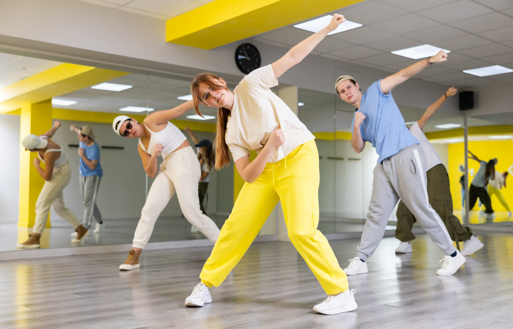 Young girl training breakdance Toprock moves in dance hall