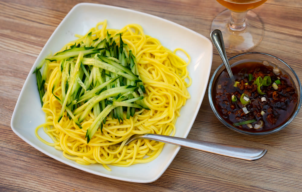 Noodles with cucumbers and meat sauce