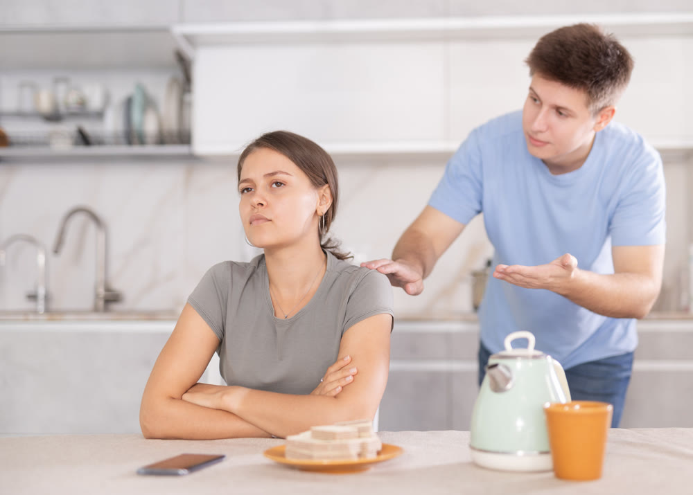 Angry guy swears at young girl, family quarrel.