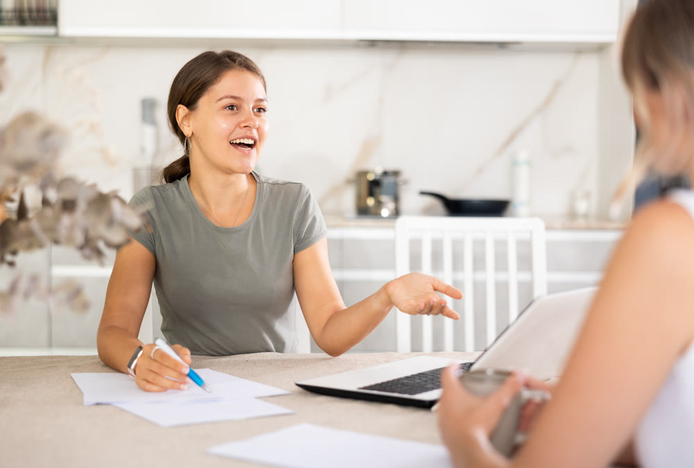 An insurance agent tells young girl the terms of property and life insurance