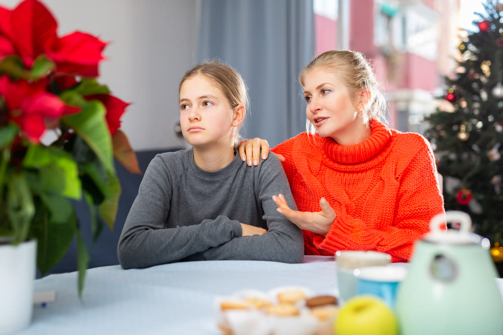 Mom soothes her teen daughter after domestic fight