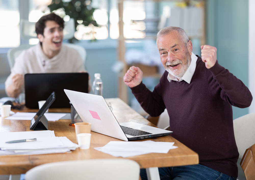 Happy male managers celebrate business success. Winning stock exchange bid