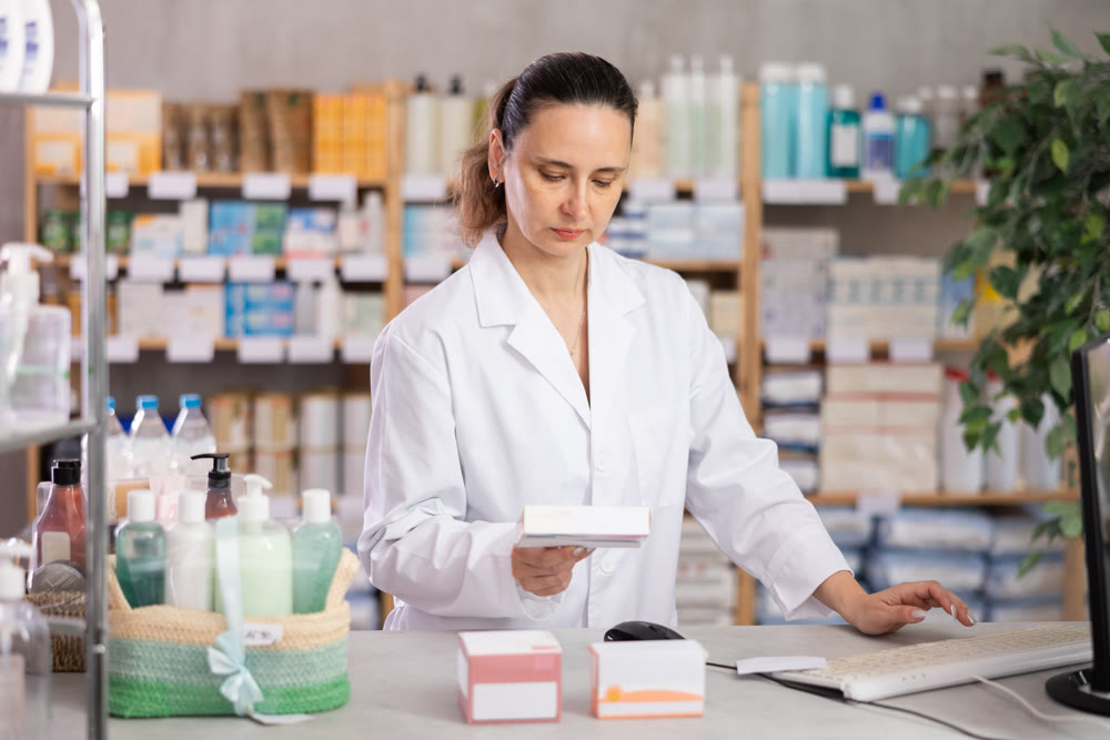 Woman pharmacist offers medication drug remedy