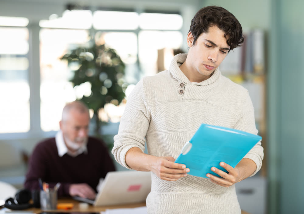 Guy office male employee read documents