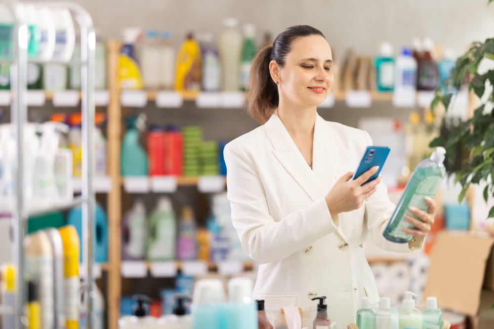 Adult woman scanning qr code for dishwashing